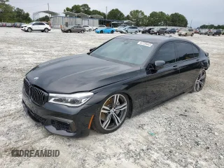2019 BMW 7 Series 750i with VIN WBA7F0C57KGM25906, listed as a Copart auction lot 62728443 with 61,561 mi miles. Bid and sale history available at carsss.com. Image 1.
