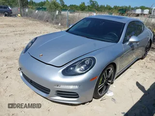 2014 Porsche Panamera S E-Hybrid with VIN WP0AD2A75EL044663, listed as a IAAI auction lot 41818381 with 44,194 mi miles and . Bid and sale history available at DreamBid. Image 2.