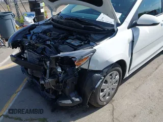 2023 Kia Rio S with VIN 3KPA25AD0PE629868, listed as a IAAI auction lot 41738952 with 25,642 mi miles and . Bid and sale history available at DreamBid. Image 6.