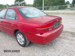 1998 Mercury Mystique z VIN 3MELM6537WM600056, wystawiony jako IAAI lot #42305711 z przebiegiem 206 104 mil mil oraz . Historia ofert i sprzedaży dostępna na DreamBid. Obrazek 6.