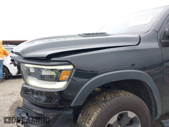 2019 Ram 1500 Rebel z VIN 1C6SRFLT1KN722064, wystawiony jako IAAI lot #41513201 z przebiegiem 113 559 mil mil oraz . Historia ofert i sprzedaży dostępna na DreamBid. Obrazek 12.