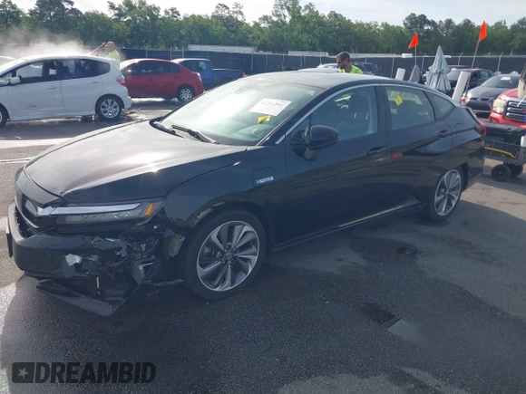 2021 Honda Clarity Touring z VIN JHMZC5F3XMC001253, wystawiony jako IAAI lot #42212102 z przebiegiem 35 649 mil mil oraz . Historia ofert i sprzedaży dostępna na DreamBid. Obrazek 2.