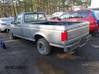 1995 Ford F-150 with VIN 1FTDF15YXSNA29547, listed as a IAAI auction lot 41569707 with 185,000 mi miles. Bid and sale history available at carsss.com. Image 3.
