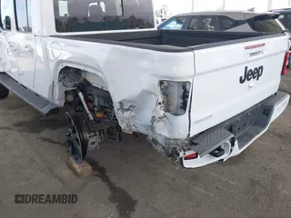 2023 Jeep Gladiator Overland with VIN 1C6HJTFG7PL543870, listed as a IAAI auction lot 42056969 with 28,655 mi miles and . Bid and sale history available at DreamBid. Image 6.