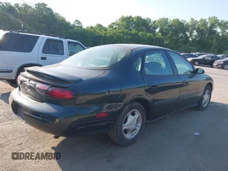 1999 Ford Taurus SE Comfort z VIN 1FAFP53S3XG104165, wystawiony jako IAAI lot #42234147 z przebiegiem 183 124 mil mil oraz . Historia ofert i sprzedaży dostępna na DreamBid. Obrazek 4.