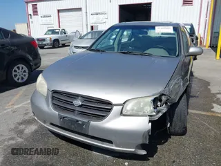 2001 Nissan Maxima GXE with VIN JN1CA31D41T815592, listed as a IAAI auction lot 42465005 with 96,822 mi miles and . Bid and sale history available at DreamBid. Image 12.