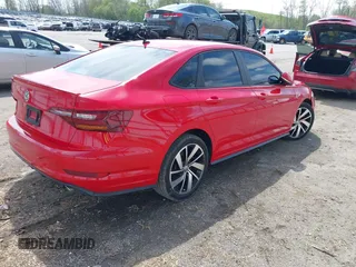 2019 Volkswagen Jetta GLI S z VIN 3VW6T7BU3KM255295, wystawiony jako IAAI lot #42173746 z przebiegiem 63 526 mil mil oraz . Historia ofert i sprzedaży dostępna na DreamBid. Obrazek 4.