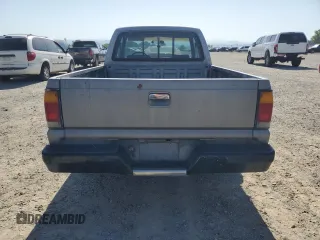 1993 Mazda B-Series Truck z VIN JM2UF3130P0378304, wystawiony jako Copart lot #58799925 z przebiegiem 132 801 mil mil oraz Szkoda całkowita • Salvage title. Historia ofert i sprzedaży dostępna na DreamBid. Obrazek 6.