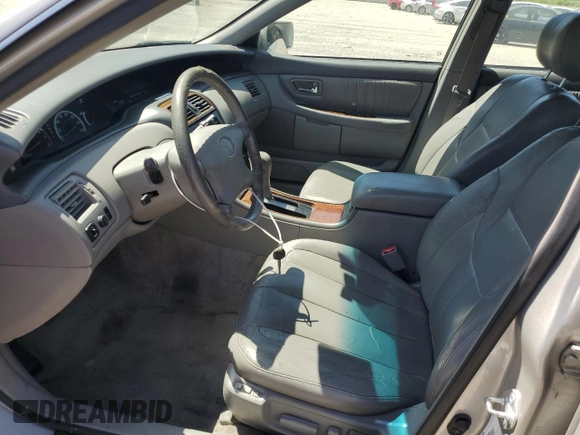 2001 Toyota Avalon XL z VIN 4T1BF28B11U154831, wystawiony jako Copart lot #57131435 z przebiegiem 211 745 mil mil oraz Szkody całkowita. Historia ofert i sprzedaży dostępna na DreamBid. Obrazek 7.