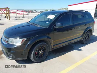 2015 Dodge Journey SXT with VIN 3C4PDCBG0FT595359, listed as a IAAI auction lot 41987773 with 135,528 mi miles. Bid and sale history available at carsss.com. Image 2.