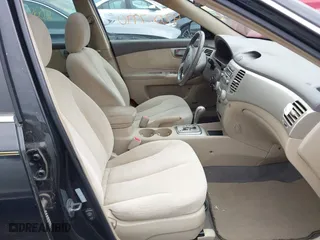 2007 Kia Optima LX with VIN KNAGE124975133923, listed as a IAAI auction lot 42007990 with 87,768 mi miles. Bid and sale history available at carsss.com. Image 5.