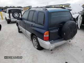 2002 Chevrolet Tracker LT with VIN 2CNBE634126928532, listed as a Copart auction lot 76990704 with Not provided miles and Salvage title. Bid and sale history available at DreamBid. Image 2.