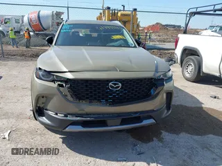 2024 Mazda CX-50 Premium z VIN 7MMVABDYXRN229669, wystawiony jako IAAI lot #41999385 z przebiegiem 10 882 mil mil oraz . Historia ofert i sprzedaży dostępna na DreamBid. Obrazek 12.