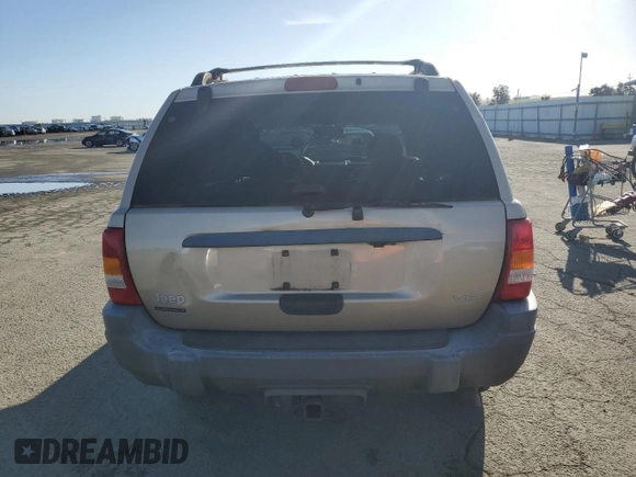 1999 Jeep Grand Cherokee Laredo z VIN 1J4GW58NXXC704719, wystawiony jako Copart lot #49546395 z przebiegiem 276 716 mil mil oraz Czysty tytuł • Clean title. Historia ofert i sprzedaży dostępna na DreamBid. Obrazek 6.