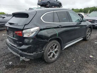 2018 BMW X1 xDrive28i z VIN WBXHT3C39J5L34133, wystawiony jako Copart lot #60195805 z przebiegiem 49 551 mil mil oraz Szkoda całkowita • Salvage title. Historia ofert i sprzedaży dostępna na DreamBid. Obrazek 3.
