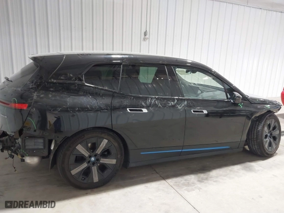 2023 BMW iX xDrive50 with VIN WB523CF04PCL15607, listed as a IAAI auction lot 41315457 with 44,058 mi miles. Bid and sale history available at carsss.com. Image 14.