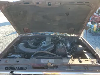 1988 Ford Bronco z VIN 1FMCU14T3JUD16266, wystawiony jako Copart lot #77365034 z przebiegiem 81 445 mil mil oraz Szkoda całkowita • Salvage title. Historia ofert i sprzedaży dostępna na DreamBid. Obrazek 11.