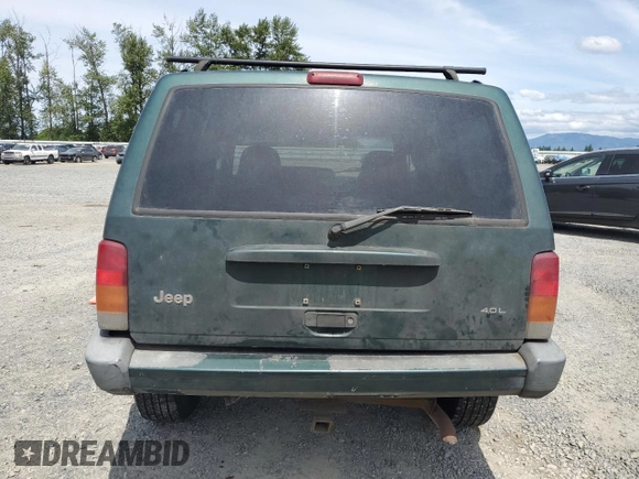 1999 Jeep Cherokee Sport with VIN 1J4FF68S2XL570795, listed as a Copart auction lot 61860585 with 320,467 mi miles and Salvage title. Bid and sale history available at DreamBid. Image 6.