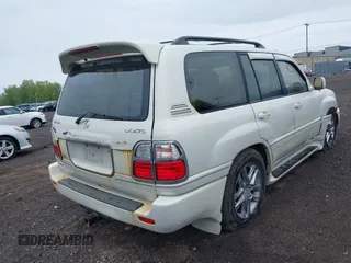 2000 Lexus LX 470 z VIN JT6HT00W8Y0096929, wystawiony jako IAAI lot #42316574 z przebiegiem 227 839 mil mil oraz . Historia ofert i sprzedaży dostępna na DreamBid. Obrazek 4.