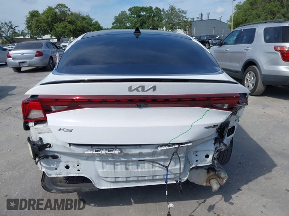 2022 Kia K5 GT-Line z VIN 5XXG64J24NG114772, wystawiony jako IAAI lot #42161747 z przebiegiem 60 761 mil mil oraz . Historia ofert i sprzedaży dostępna na DreamBid. Obrazek 17.