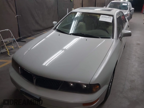 1999 Mitsubishi Diamante z VIN 6MMAP47P4XT003895, wystawiony jako IAAI lot #41992452 z przebiegiem 170 964 mil mil oraz . Historia ofert i sprzedaży dostępna na DreamBid. Obrazek 6.