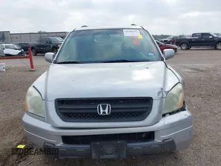 2003 Honda Pilot EX with VIN 2HKYF18623H576163, listed as a IAAI auction lot 41948133 with 244,516 mi miles and . Bid and sale history available at DreamBid. Image 12.
