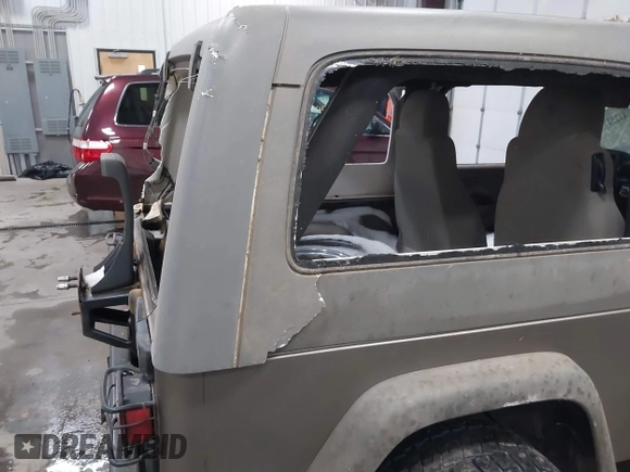 2006 Jeep Wrangler Unlimited LWB with VIN 1J4FA44S96P714309, listed as a IAAI auction lot 41252391 with 164,720 mi miles. Bid and sale history available at carsss.com. Image 12.