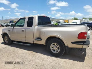 1998 Ford F-150 XL with VIN 1FTRX07L6WKB62554, listed as a Copart auction lot 67597854 with 100,528 mi miles and Salvage Title. Bid and sale history available at carsss.com. Image 2.