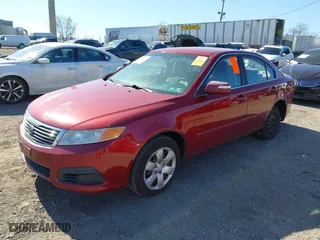 2009 Kia Optima LX with VIN KNAGE228X95314931, listed as a IAAI auction lot 41890304 with 217,901 mi miles. Bid and sale history available at carsss.com. Image 2.