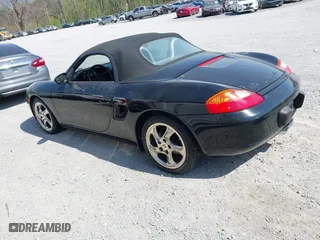 1999 Porsche Boxster with VIN WP0CA2980XU624284, listed as a IAAI auction lot 42058935 with 79,497 mi miles. Bid and sale history available at carsss.com. Image 3.