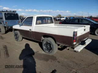 1987 Nissan Hardbody E z VIN JN6ND11S4HW011430, wystawiony jako Copart lot #81785214 z przebiegiem 334 566 mil mil oraz Tytuł czysty. Historia ofert i sprzedaży dostępna na DreamBid. Obrazek 2.
