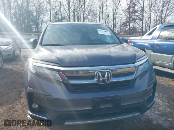 2019 Honda Pilot Touring 7-Passenger with VIN 5FNYF6H67KB018769, listed as a IAAI auction lot 41310452 with 92,499 mi miles. Bid and sale history available at carsss.com. Image 11.