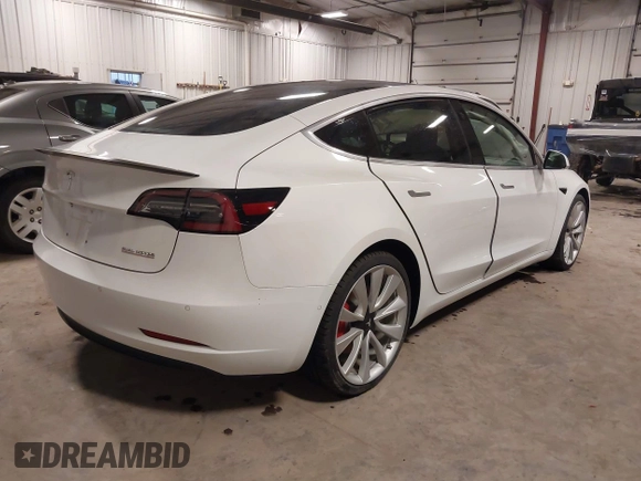 2018 Tesla Model 3 Long Range Battery with VIN 5YJ3E1EB5JF084446, listed as a IAAI auction lot 41209852 with 70,125 mi miles and . Bid and sale history available at DreamBid. Image 4.