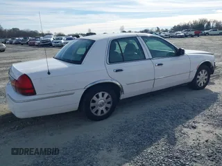 2005 Mercury Grand Marquis LS Premium z VIN 2MEFM75W05X621461, wystawiony jako IAAI lot #41381365 z przebiegiem 139 971 mil mil oraz . Historia ofert i sprzedaży dostępna na DreamBid. Obrazek 4.