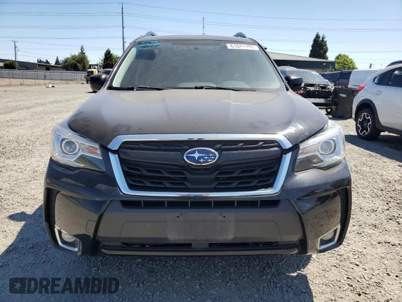 2017 Subaru Forester Touring z VIN JF2SJGWCXHH805812, wystawiony jako Copart lot #61081795 z przebiegiem 99 017 mil mil oraz Szkoda całkowita • Salvage title. Historia ofert i sprzedaży dostępna na DreamBid. Obrazek 5.