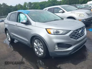 2021 Ford Edge Titanium z VIN 2FMPK3K97MBA18078, wystawiony jako IAAI lot #42305020 z przebiegiem 76 910 mil mil oraz . Historia ofert i sprzedaży dostępna na DreamBid. Obrazek 1.