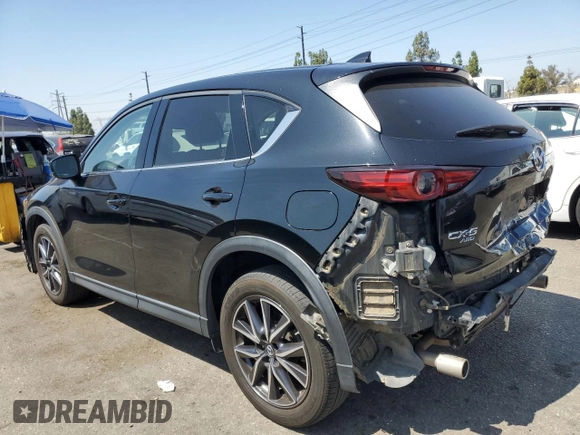2018 Mazda CX-5 Grand Touring with VIN JM3KFBDM4J0348165, listed as a Copart auction lot 62733665 with 80,693 mi miles and Salvage title. Bid and sale history available at DreamBid. Image 2.