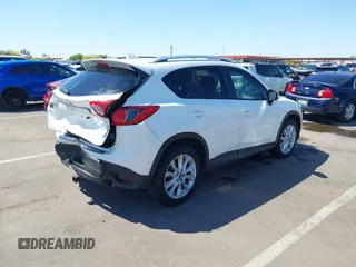 2015 Mazda CX-5 Grand Touring with VIN JM3KE2DYXF0493370, listed as a IAAI auction lot 42087156 with 161,464 mi miles. Bid and sale history available at carsss.com. Image 4.