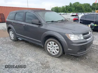 2014 Dodge Journey American Value z VIN 3C4PDCAB5ET216795, wystawiony jako IAAI lot #42460683 z przebiegiem 122 928 mil mil oraz . Historia ofert i sprzedaży dostępna na DreamBid. Obrazek 1.