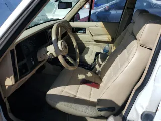 1993 Jeep Cherokee Sport with VIN 1J4FJ68S4PL555701, listed as a Copart auction lot 76020714 with 130,884 mi miles and Salvage Title. Bid and sale history available at carsss.com. Image 7.