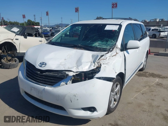 2014 Toyota Sienna LE AAS with VIN 5TDKK3DC4ES515791, listed as a IAAI auction lot 42304201 with 113,139 mi miles and . Bid and sale history available at DreamBid. Image 2.