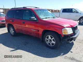 2002 GMC Envoy SLT with VIN 1GKDT13S022226885, listed as a IAAI auction lot 42036571 with 321,897 mi miles. Bid and sale history available at carsss.com. Image 1.