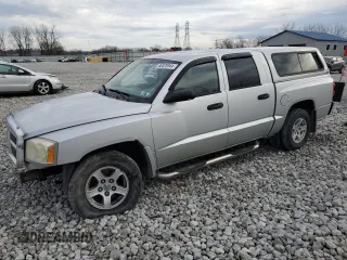 2007 Dodge Dakota SLT with VIN 1D7HW48P97S197684, listed as a Copart auction lot 86328944 with 122,969 mi miles and Salvage Title. Bid and sale history available at carsss.com. Image 1.