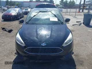 2018 Ford Focus SE z VIN 1FADP3FE9JL303933, wystawiony jako IAAI lot #42530171 z przebiegiem Nie podano mil oraz . Historia ofert i sprzedaży dostępna na DreamBid. Obrazek 11.