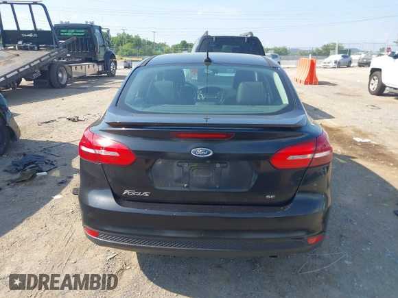 2015 Ford Focus SE z VIN 1FADP3F25FL284097, wystawiony jako IAAI lot #42553323 z przebiegiem 139 647 mil mil oraz . Historia ofert i sprzedaży dostępna na DreamBid. Obrazek 16.
