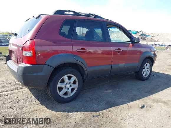 2005 Hyundai Tucson GLS with VIN KM8JN12D35U180615, listed as a IAAI auction lot 42104729 with 128,123 mi miles. Bid and sale history available at carsss.com. Image 4.