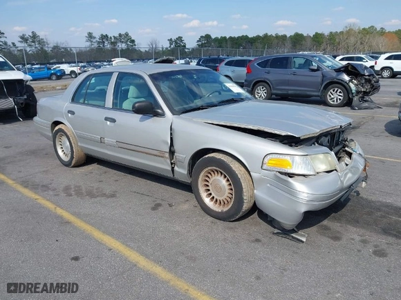 2004 Ford Crown Victoria Standard with VIN 2FAFP73W94X107561, listed as a IAAI auction lot 41804985 with 128,066 mi miles. Bid and sale history available at carsss.com. Image 1.