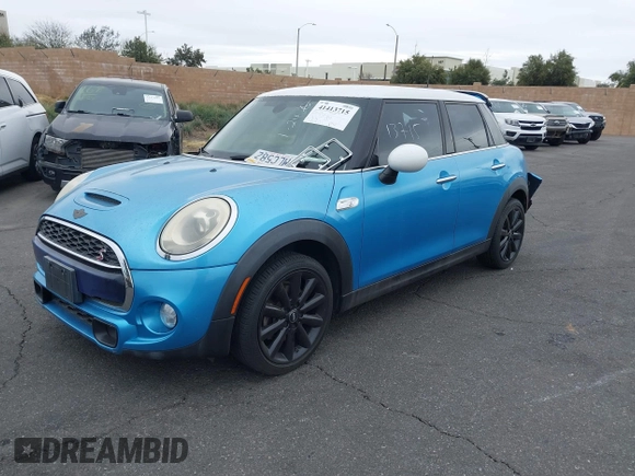 2015 MINI Hardtop 4 Door S with VIN WMWXU3C58F2B58305, listed as a IAAI auction lot 41413715 with 98,413 mi miles and . Bid and sale history available at DreamBid. Image 2.