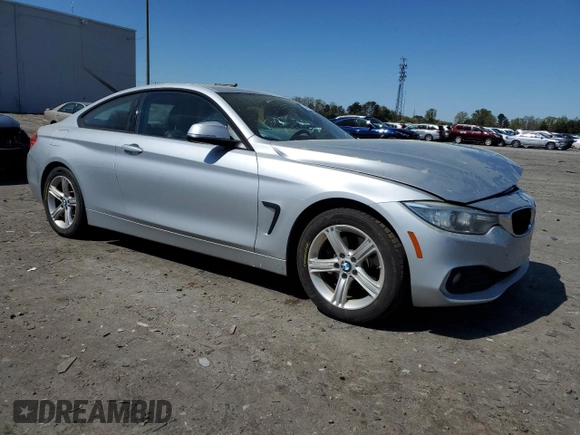 2014 BMW 4 Series 428i xDrive with VIN WBA3N5C51EF716572, listed as a Copart auction lot 52086365 with 209,742 mi miles and Salvage Title. Bid and sale history available at DreamBid. Image 4.