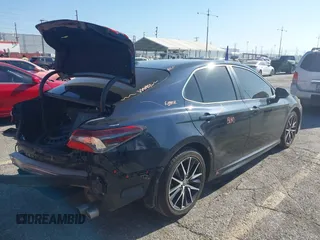2021 Toyota Camry SE Nightshade with VIN 4T1T11AKXMU430841, listed as a IAAI auction lot 42019485 with 124,561 mi miles. Bid and sale history available at carsss.com. Image 4.